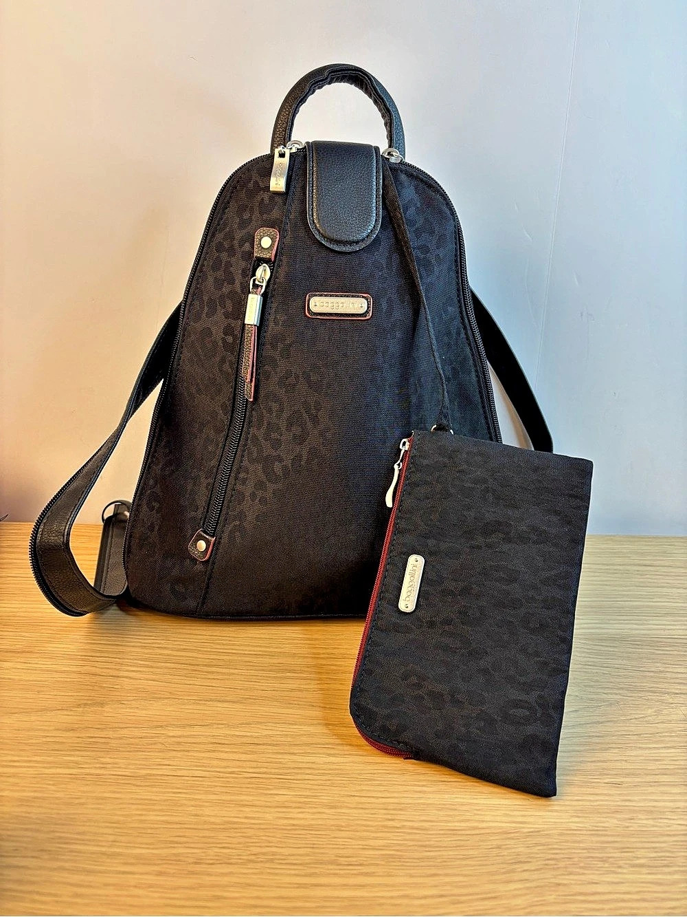 Baggallini Convertible Sling Backpack Black Cheetah with Wristlet LIKE NEW!